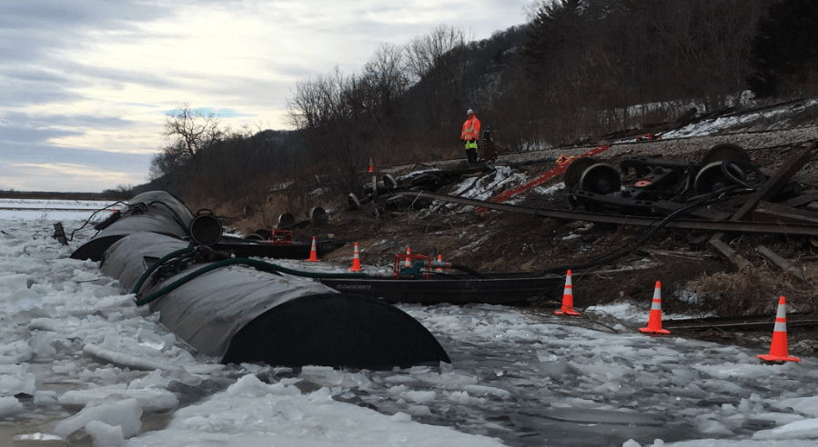 Pinnacle engineers working on a project in and along an icy riverbank.