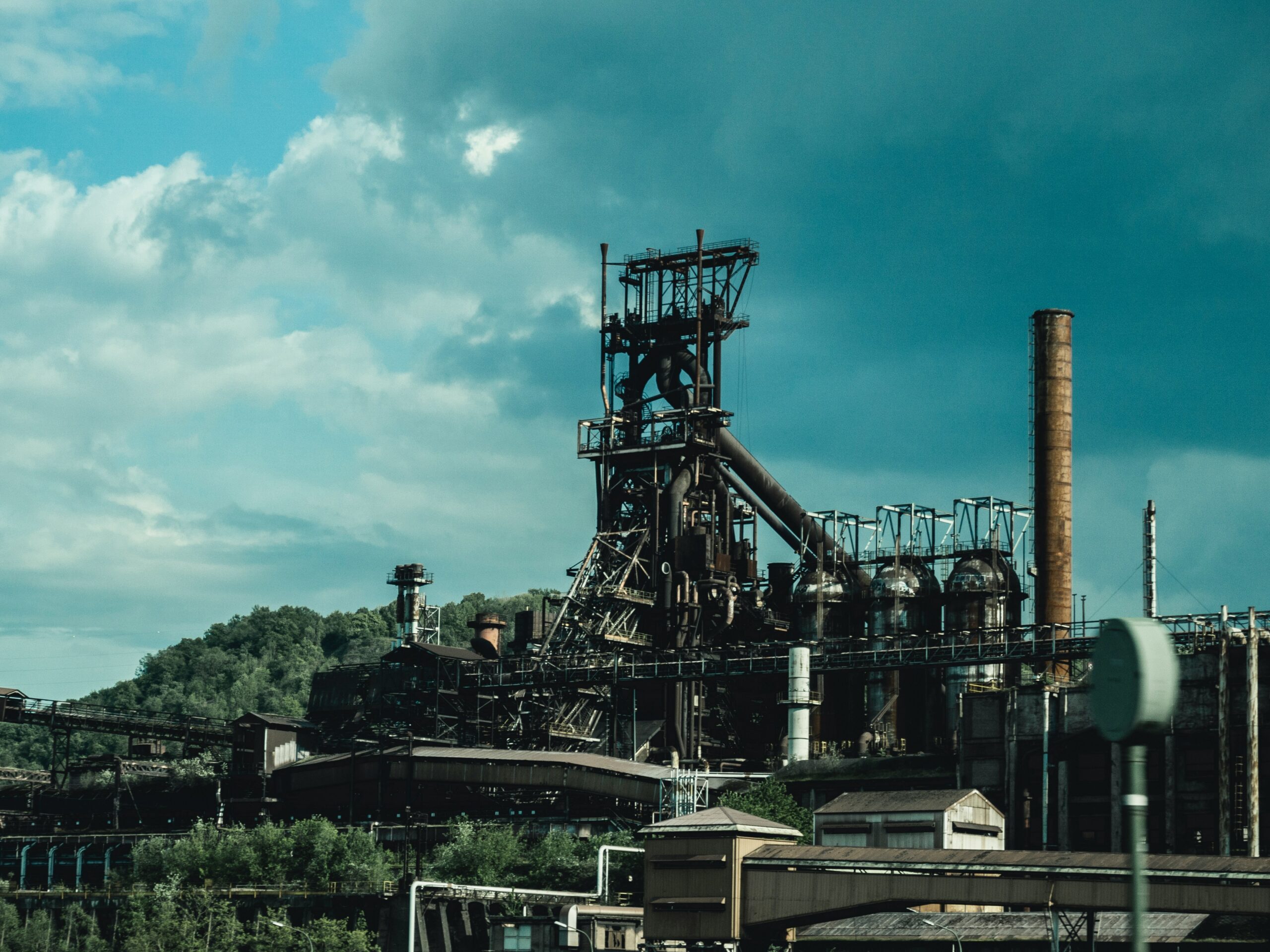 Oil refinery set against partly cloudy skies